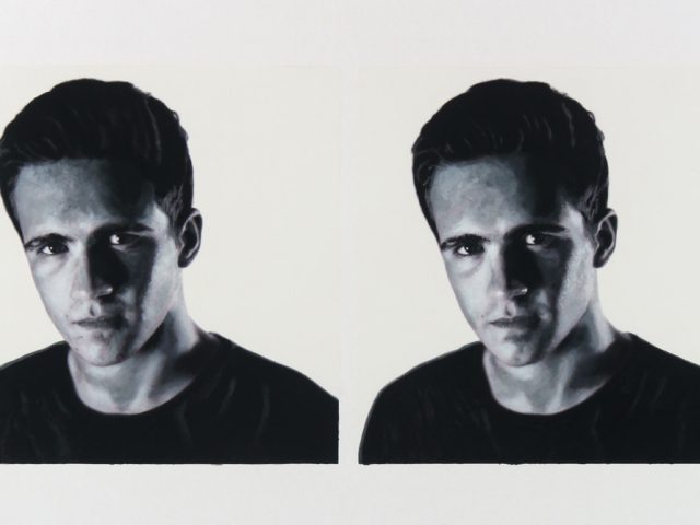 A black and white portrait of two men on a white background.