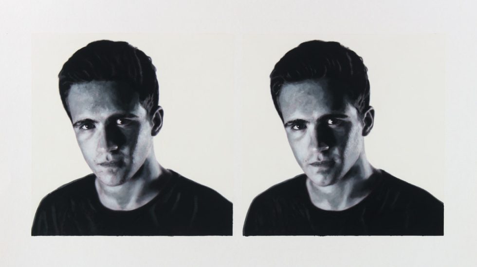 A black and white portrait of two men on a white background.