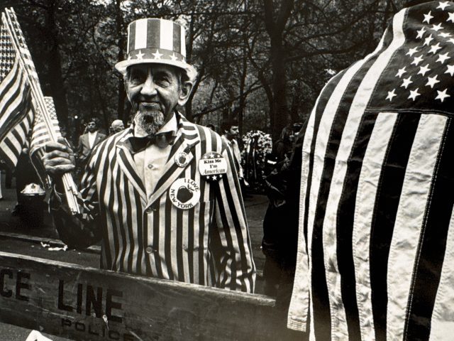 A black and white photograph of a man in an uncle sam outfit.