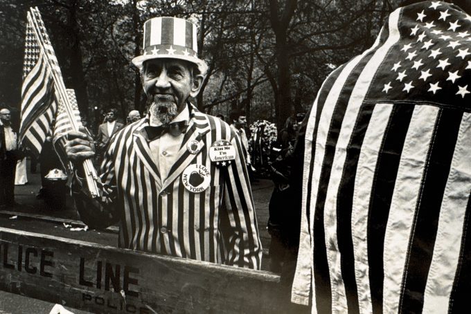 A black and white photograph of a man in an uncle sam outfit.