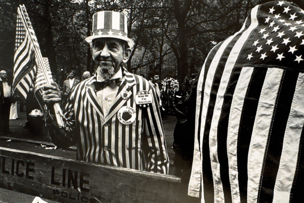 A black and white photograph of a man in an uncle sam outfit.