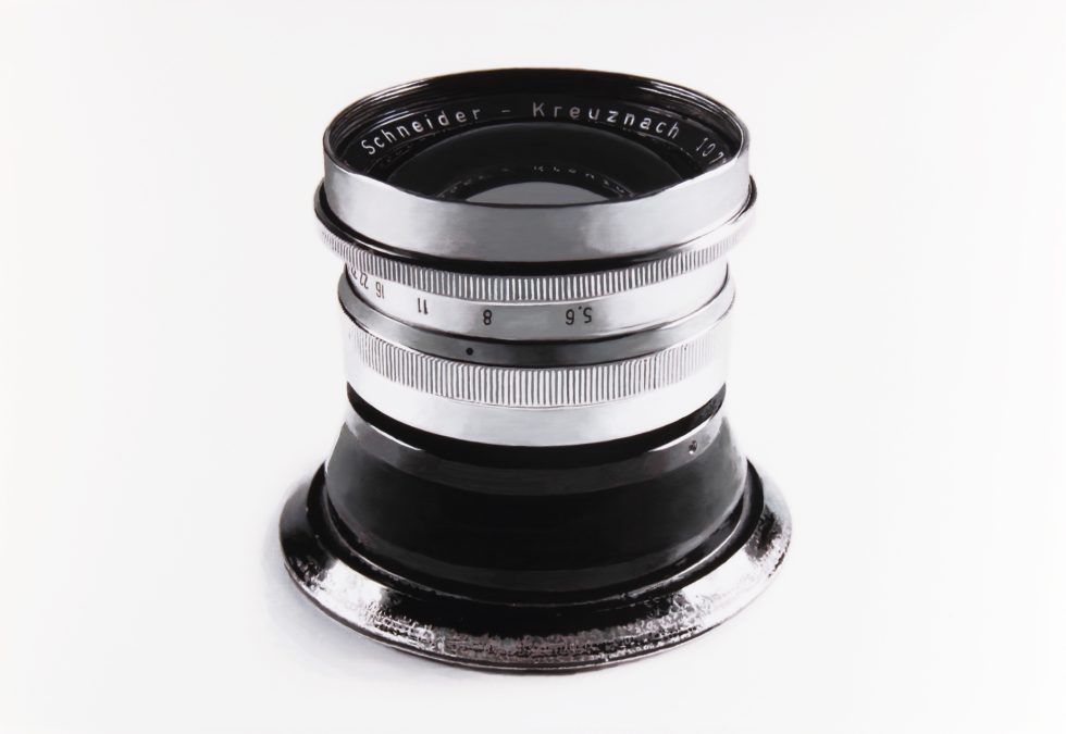 A black and white drawing of a silver camera lens on a white background.