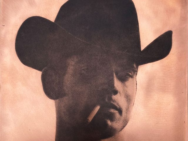 An image of a cowboy with a hat and cigarette on copper.