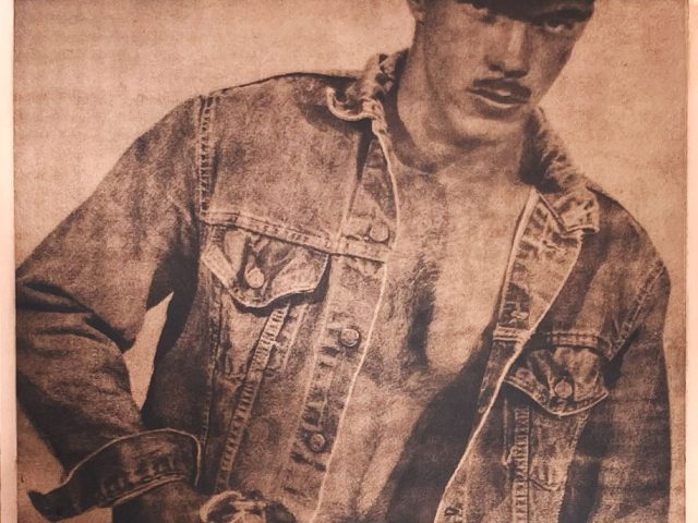 A copper image of a man in denim clothing holding a chain.