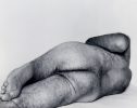 A black and white photograph of a male nude reclining.