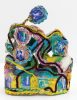 A colorful sculpture with pipe cleaners and photographs.