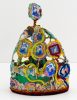 A brightly colored sculpture depicting a crown.