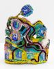 A brightly colored sculpture depicting a crown.