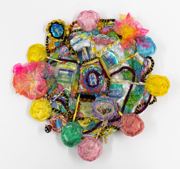A brightly colored sculpture depicting a candy dish.