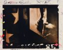 A photograph showing an american flag, sculpture, and various markings in the margins.