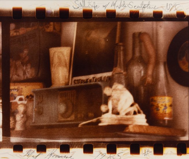 An interior space with a marble sculpture and various other objects.
