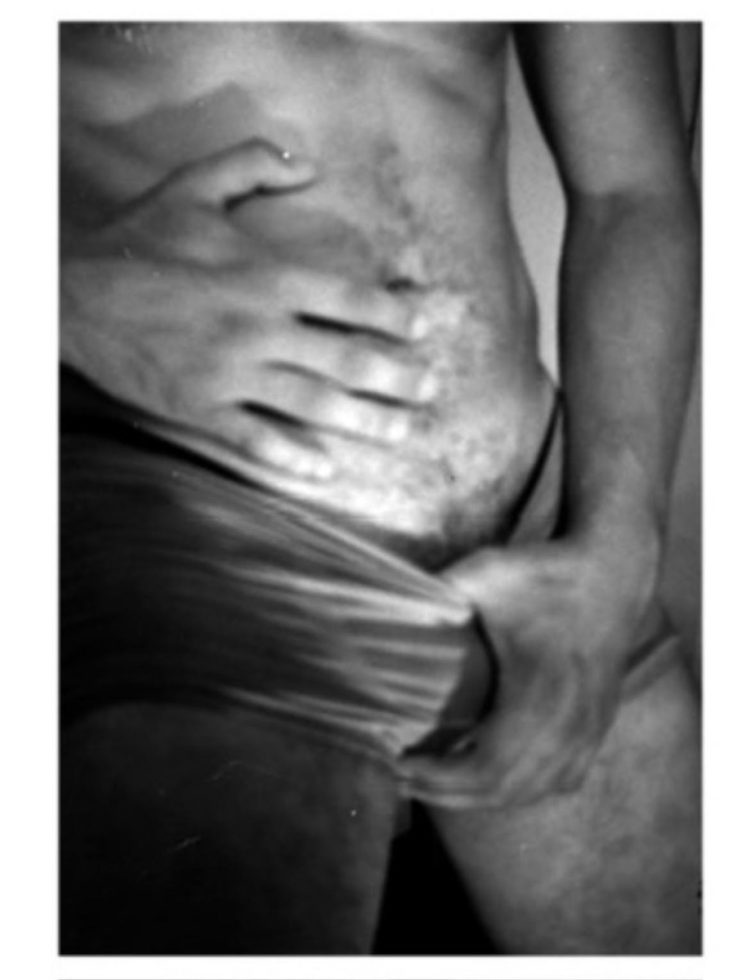 A black and white photograph of of a man in pants.