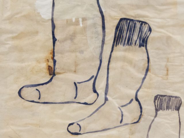 Three socks painted on masking tape in black gouche.