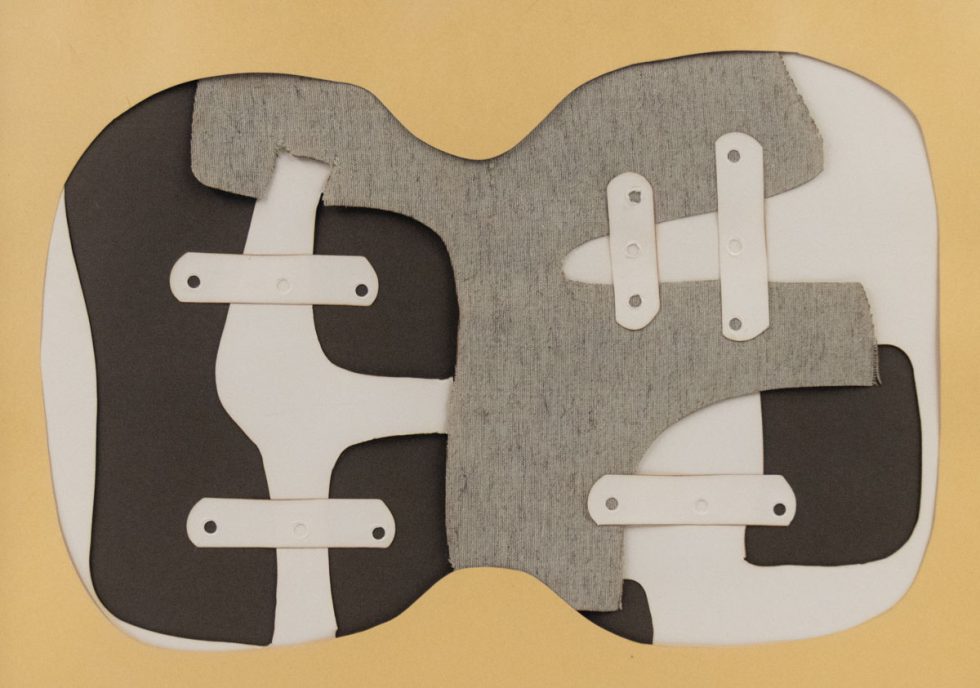 A collage of paper and fabric in gray, brown, and tan.