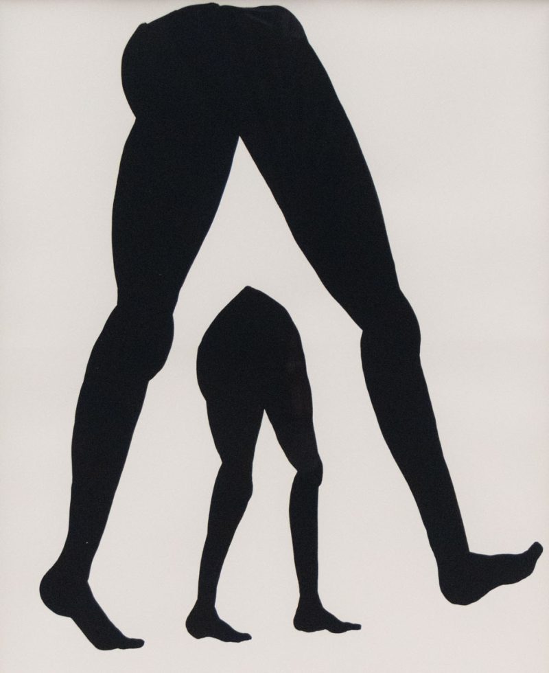 A painting of a large set of legs over a small set of legs in black gouache.