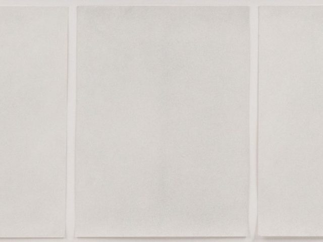 Ground bullet dust on three sheets of paper, framed.