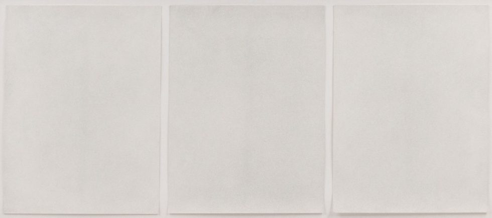 Ground bullet dust on three sheets of paper, framed.