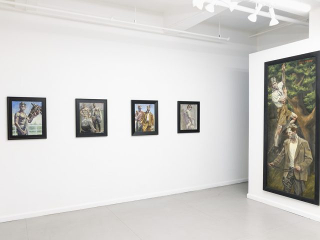 This image shows the white walls of a gallery, where a large vertical paintining by Mark Beard depicts men climbing trees. Behind them, four smaller paintings of men hang.