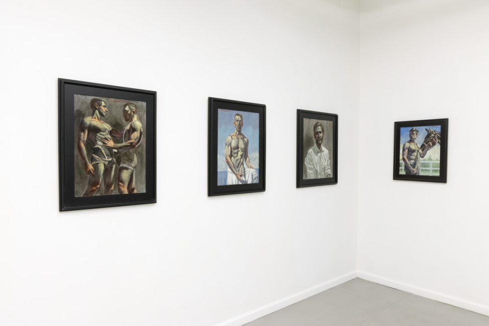 This image shows the walls of a gallery with four paintings of young man hanging in black frames.
