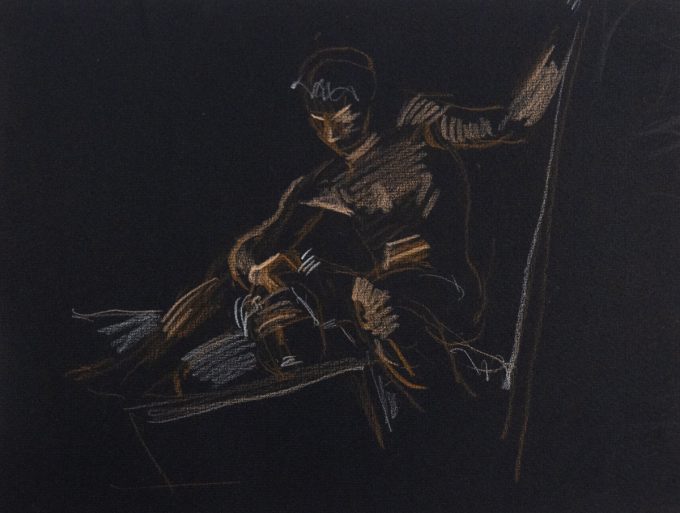 This is a sketch of a man done on black paper in brown crayon.