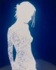 This is a silhouette of a girl over a blue background, resembling a cyanotype.