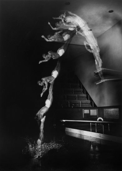 This is a multiple exposure of a man diving into a pool.