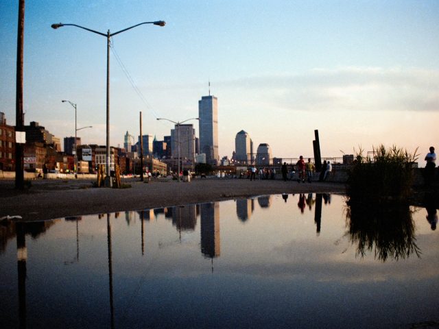 This photograph shows buildings in New York overlooking the water.
