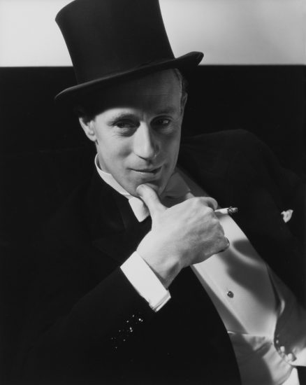 This is a black and white photograph of actor Leslie Howard in a top hat.