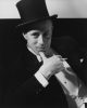 This is a black and white photograph of actor Leslie Howard in a top hat.