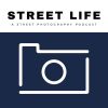This shows the outline of a camera in white against a blue background.