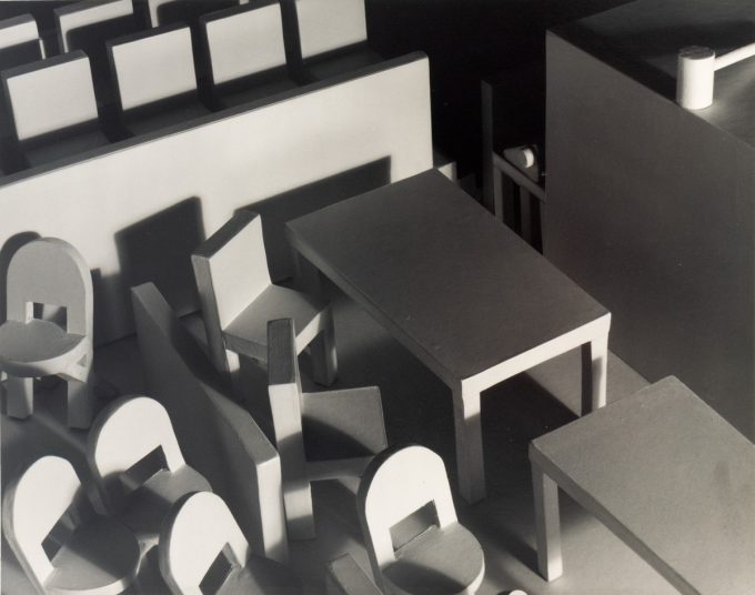 This black and white photograph shows a courtroom filled with furniture, seen from above.