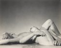 This black and white photograph shows two men lying on top of one another.
